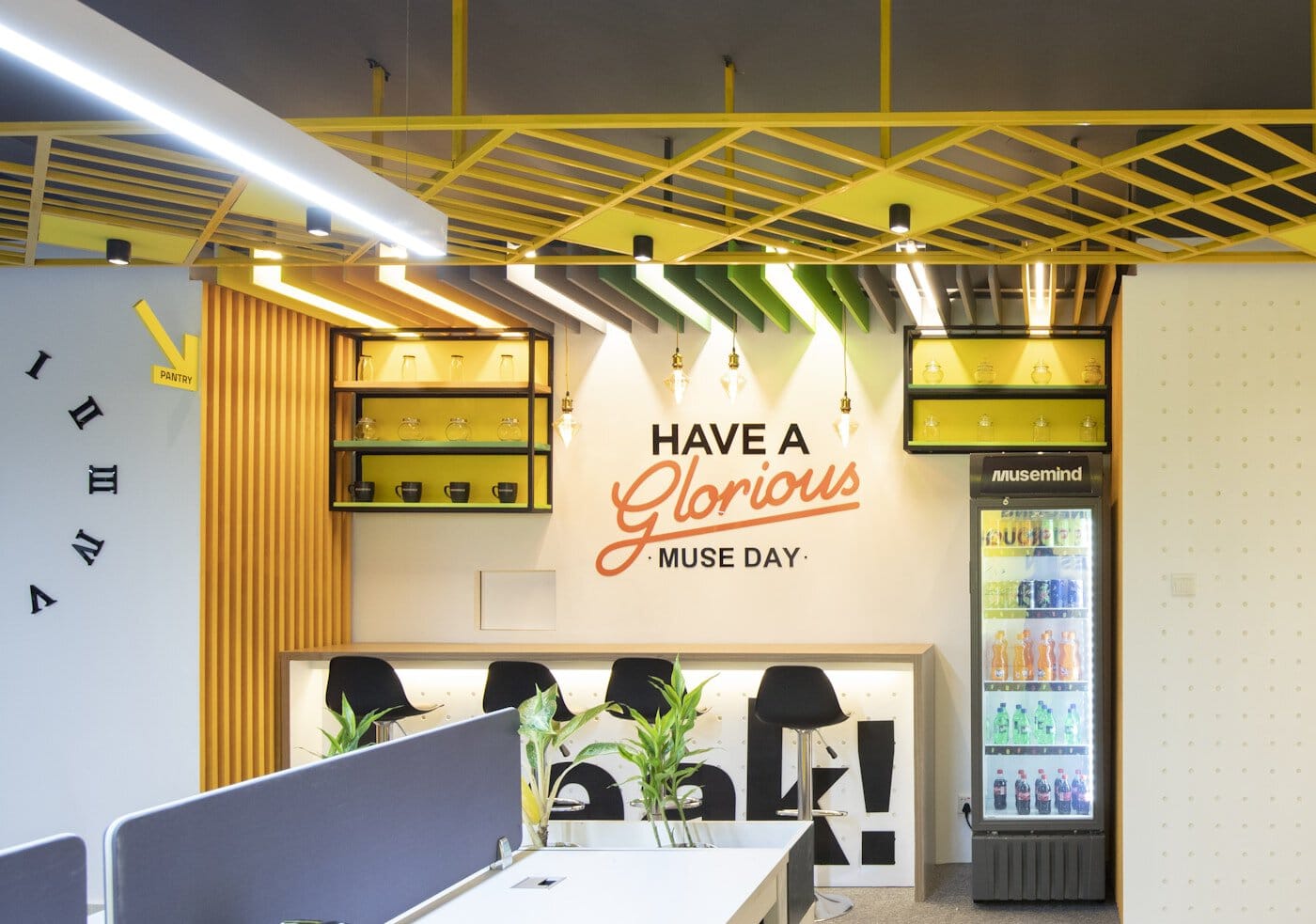 an office with a sign that says have a glorious music day
